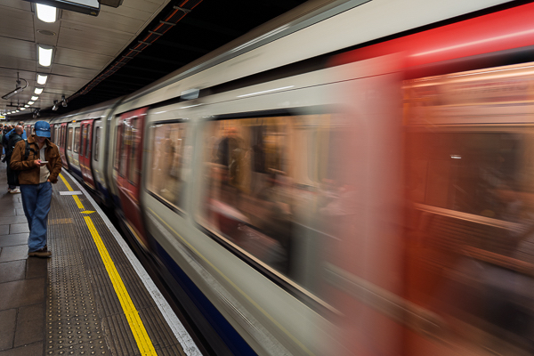 London Underground subway train, often referred to as "the Tube", pulling into a station platform