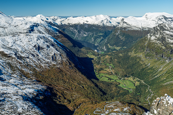 now-covered Mt. Dalsnibba viewpoint overlooking fjord below and the Norwegian Prima cruise ship